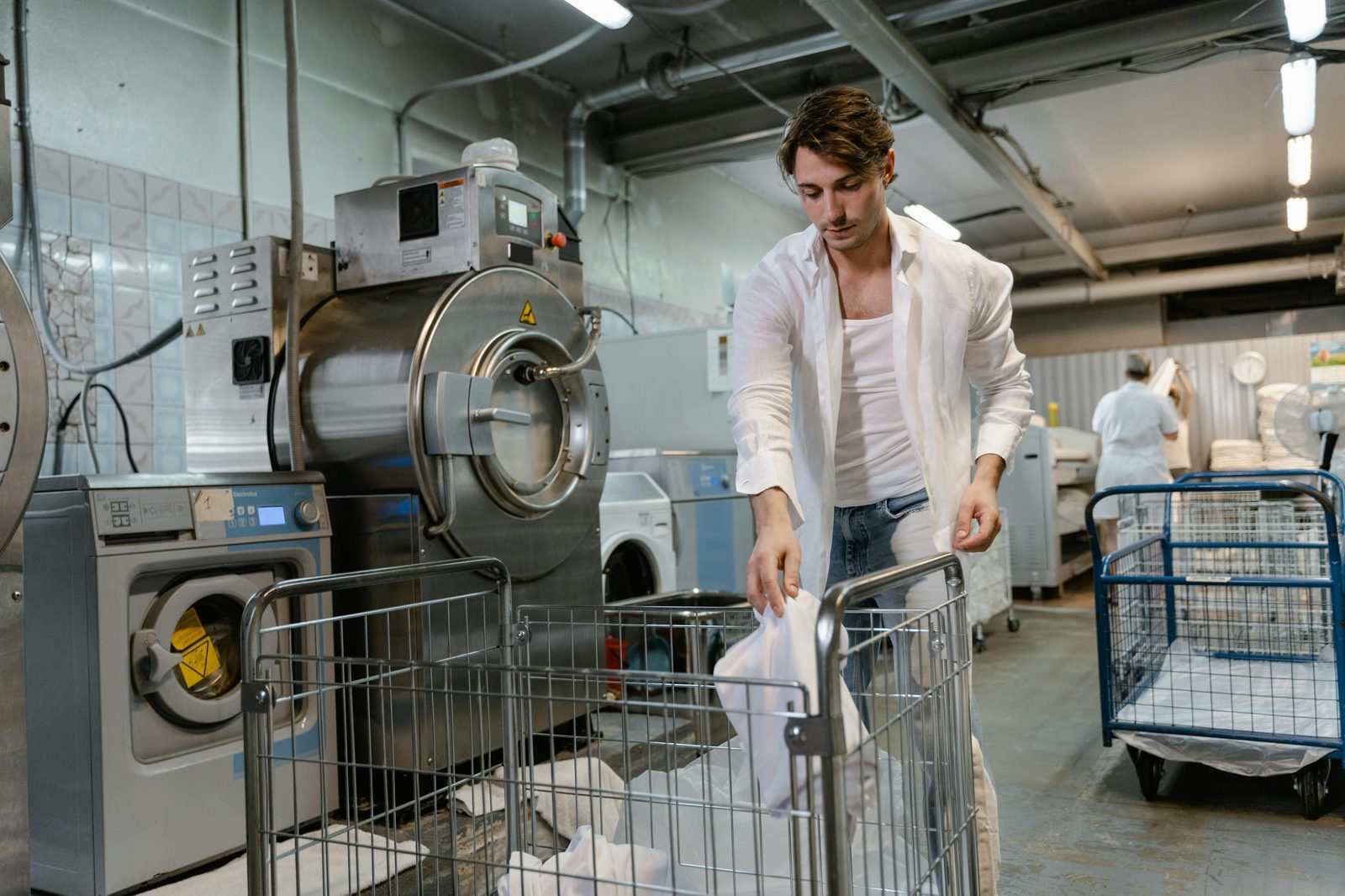 Hostel laundry with washing machines — Copenhagen hostels include guest laundry rooms at 35-50 DKK per load, useful for longer stays