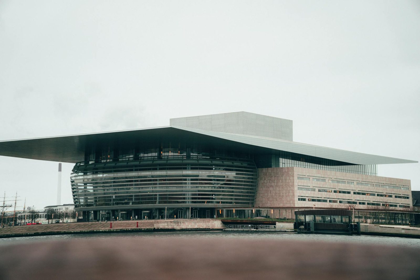 Modern Danish architecture in Copenhagen waterfront with geometric glass facades