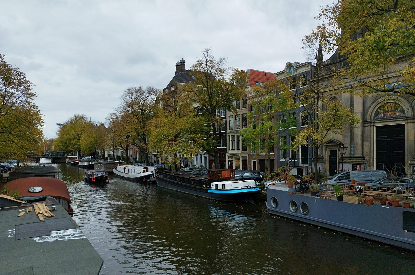 Canal lined with houseboats and historic buildings — similar to Copenhagen's Christianshavn on day 2 of a multi-day itinerary