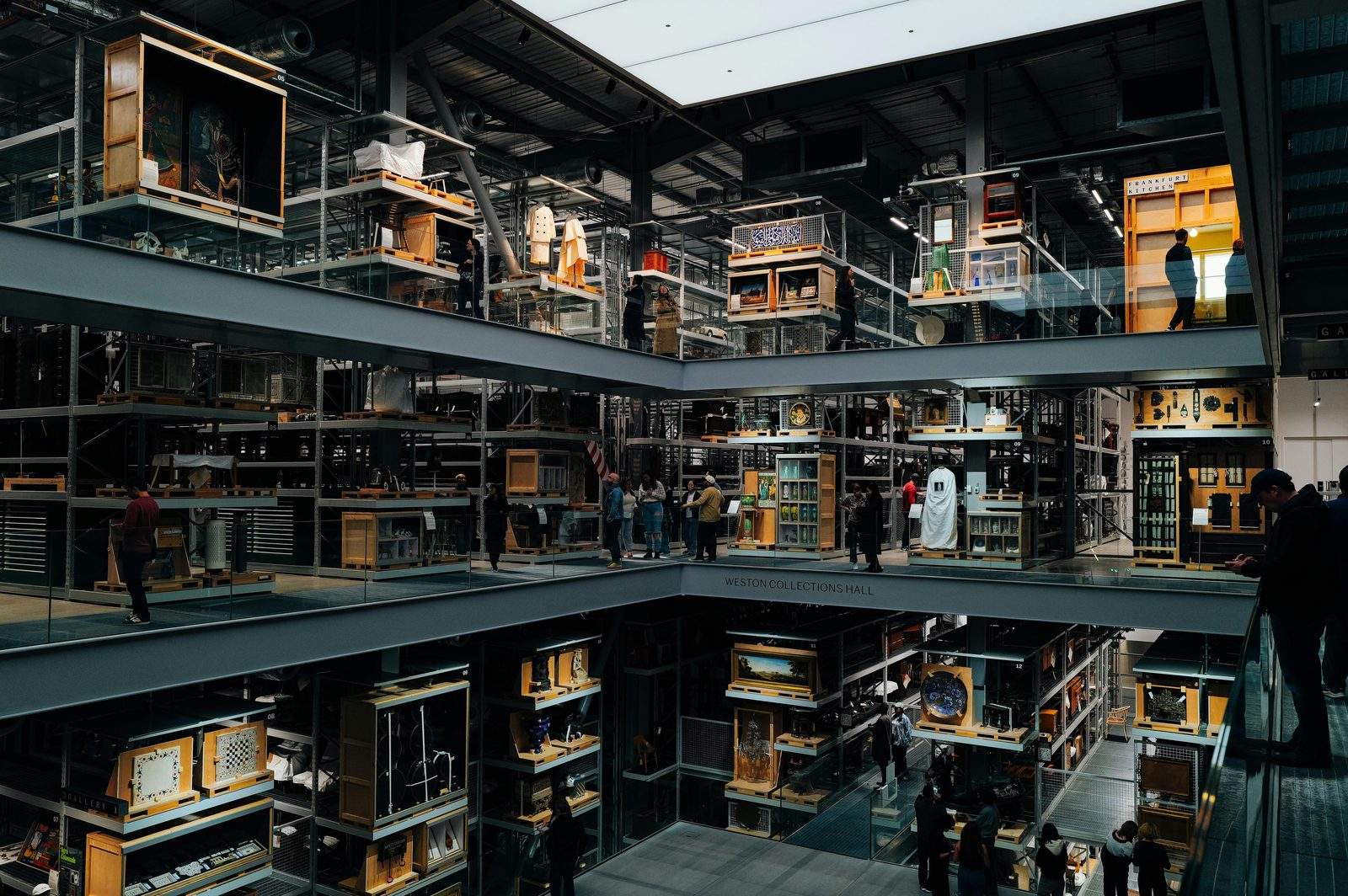 Spacious multi-level modern art museum interior with visitors — similar to Louisiana Museum of Modern Art north of Copenhagen