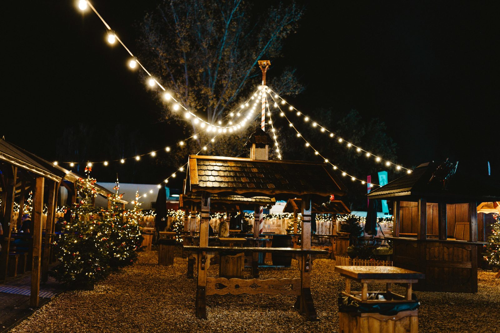 An enchanting European Christmas market at night with lights and festive decorations — Copenhagen's Tivoli, Nyhavn, Højbro Plads and Kongens Nytorv markets are open mid-November to late December