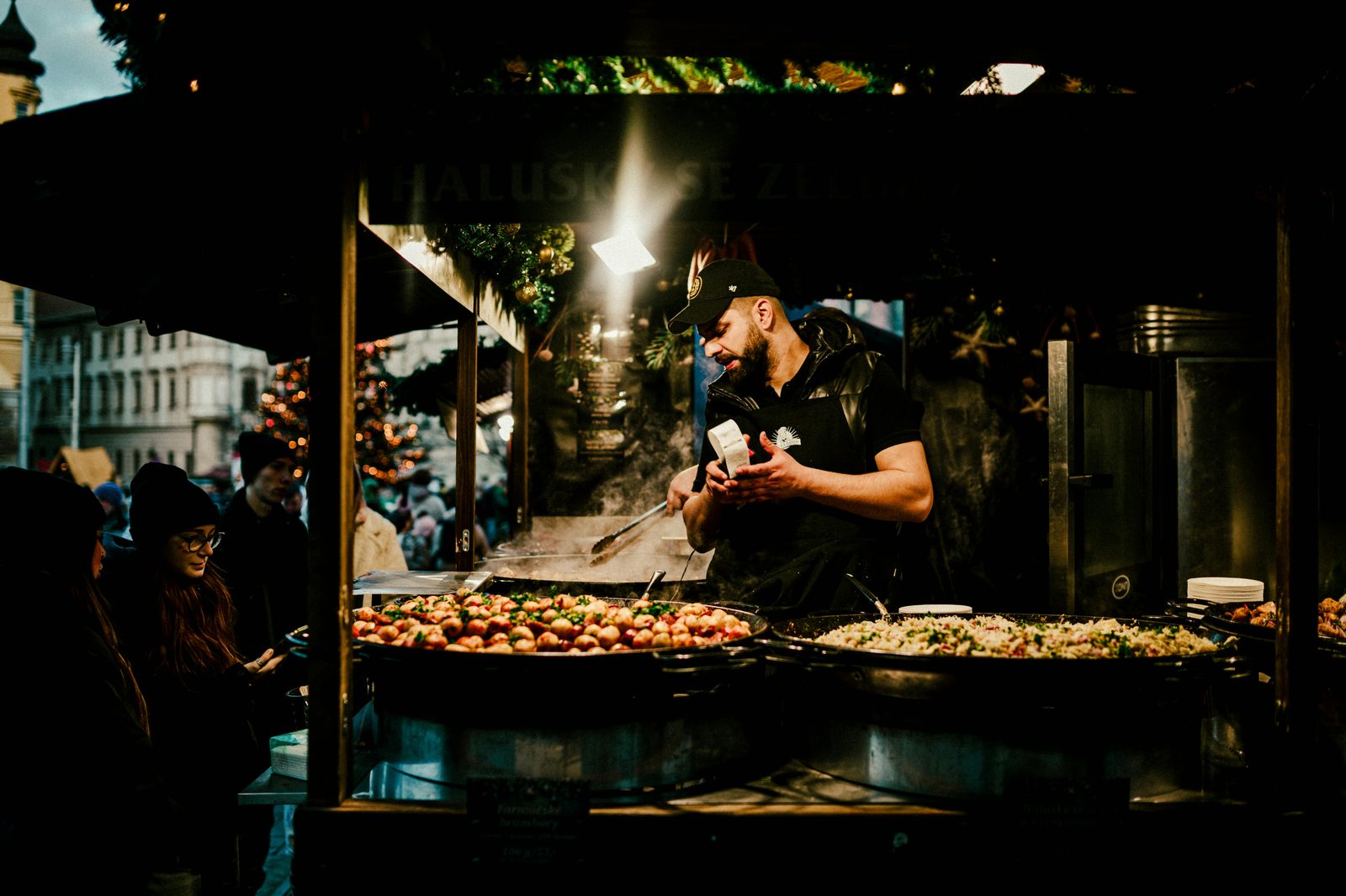 A chef prepares fresh food at a lively European market — Copenhagen Cooking & Food Festival is Northern Europe's biggest food festival, spanning 10 days every August