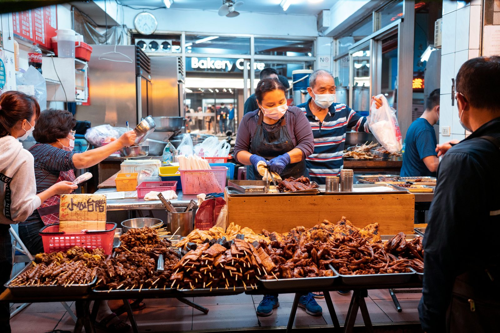 Bustling food market with vendors and hungry diners — similar to Reffen street food market on Refshaleøen