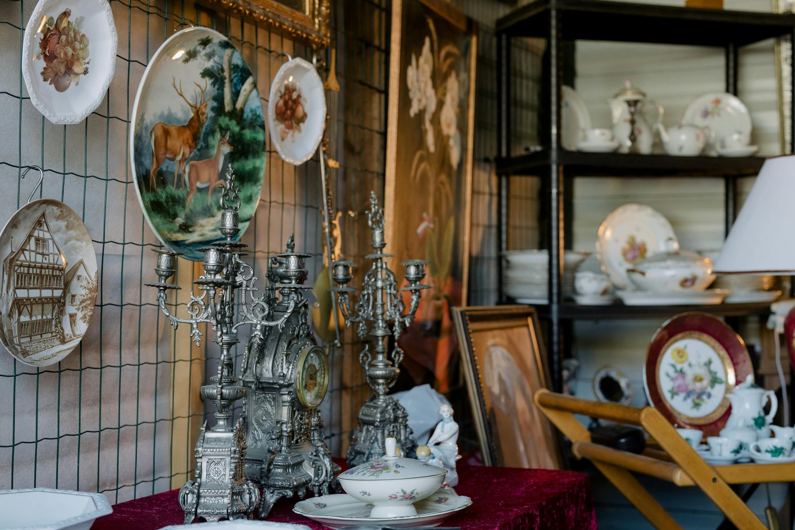 Charming assortment of vintage plates, candelabras, and tableware — Copenhagen's Bredgade is the city's historic antique and art-gallery street
