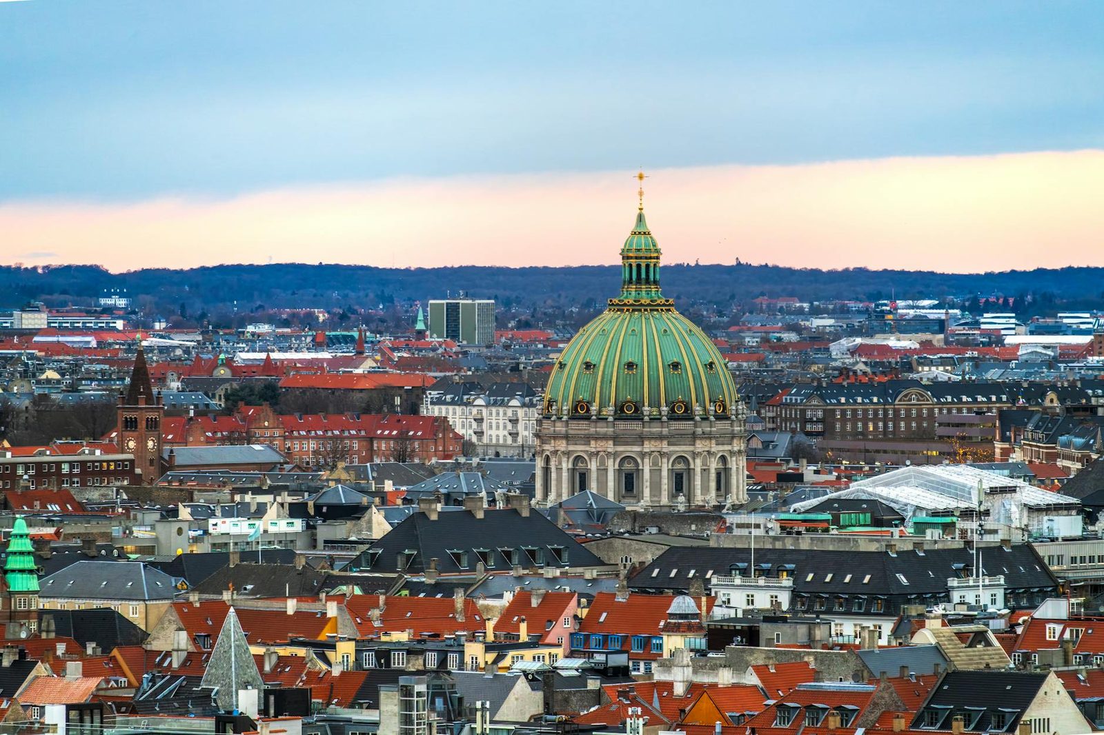 Aerial skyline view of Copenhagen showing spires, rooftops and the harbor