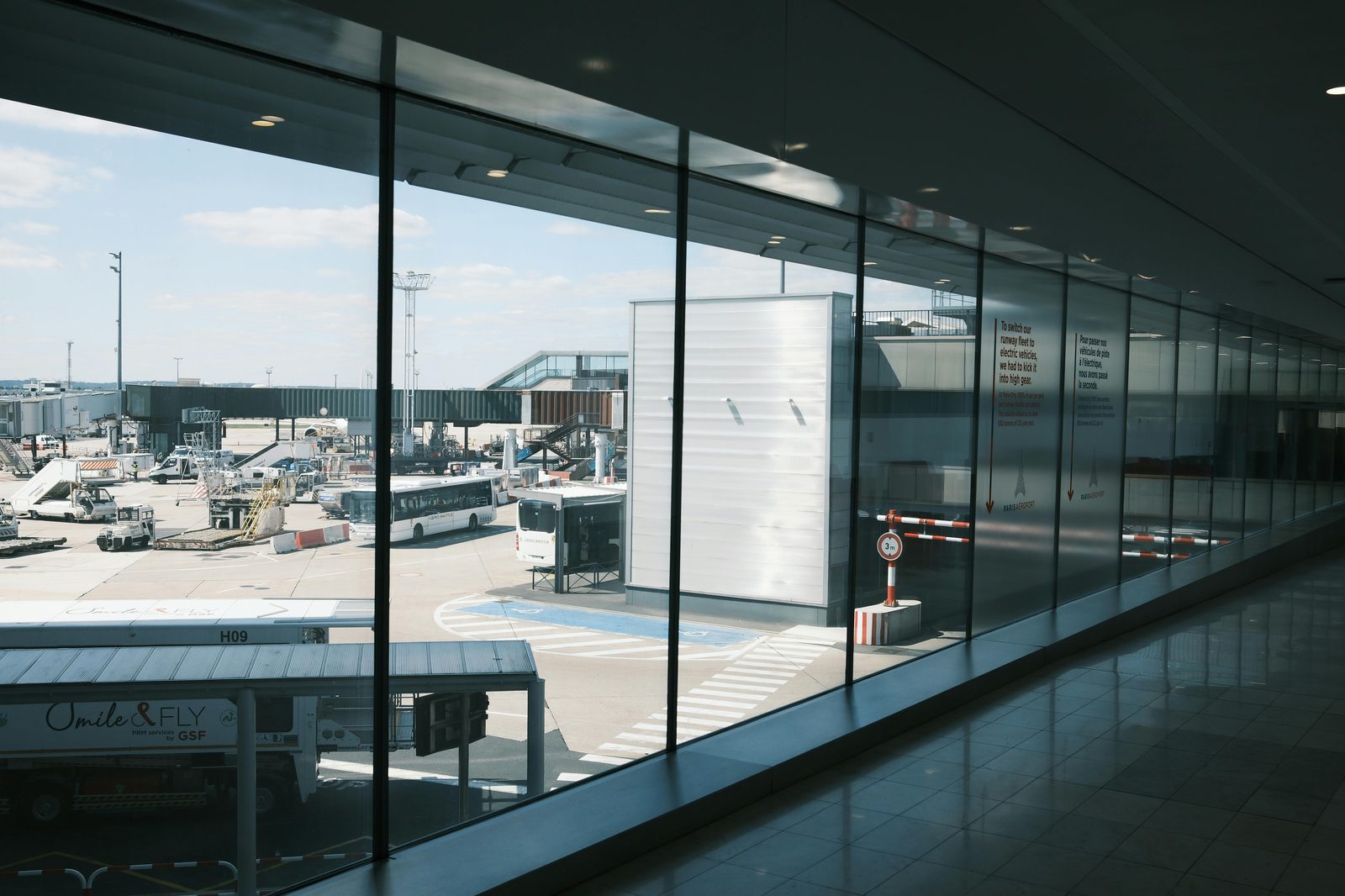 Modern airport terminal hallway — similar to Copenhagen Airport (CPH) Terminal 3, where the M2 metro runs directly into the city in 15 minutes