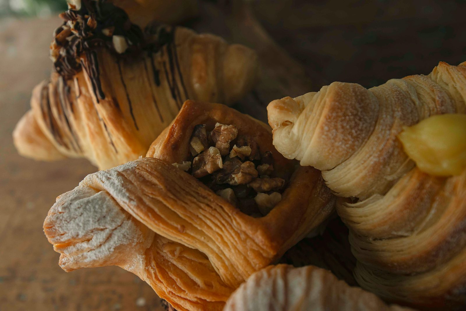 Assortment of Danish pastries including croissants, cardamom buns, and nut-filled pastries from a Copenhagen bakery
