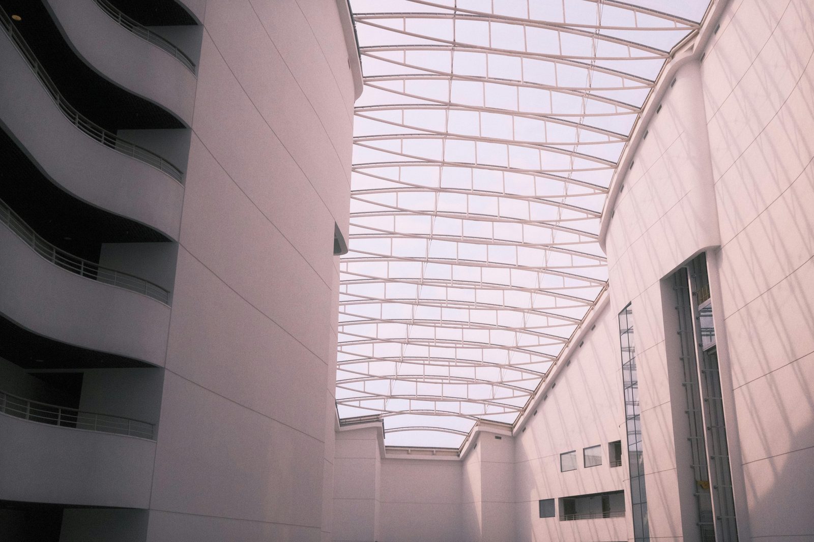 Elegant architectural atrium with a striking glass ceiling — the National Museum's central glass-roofed courtyard is the social heart of the museum
