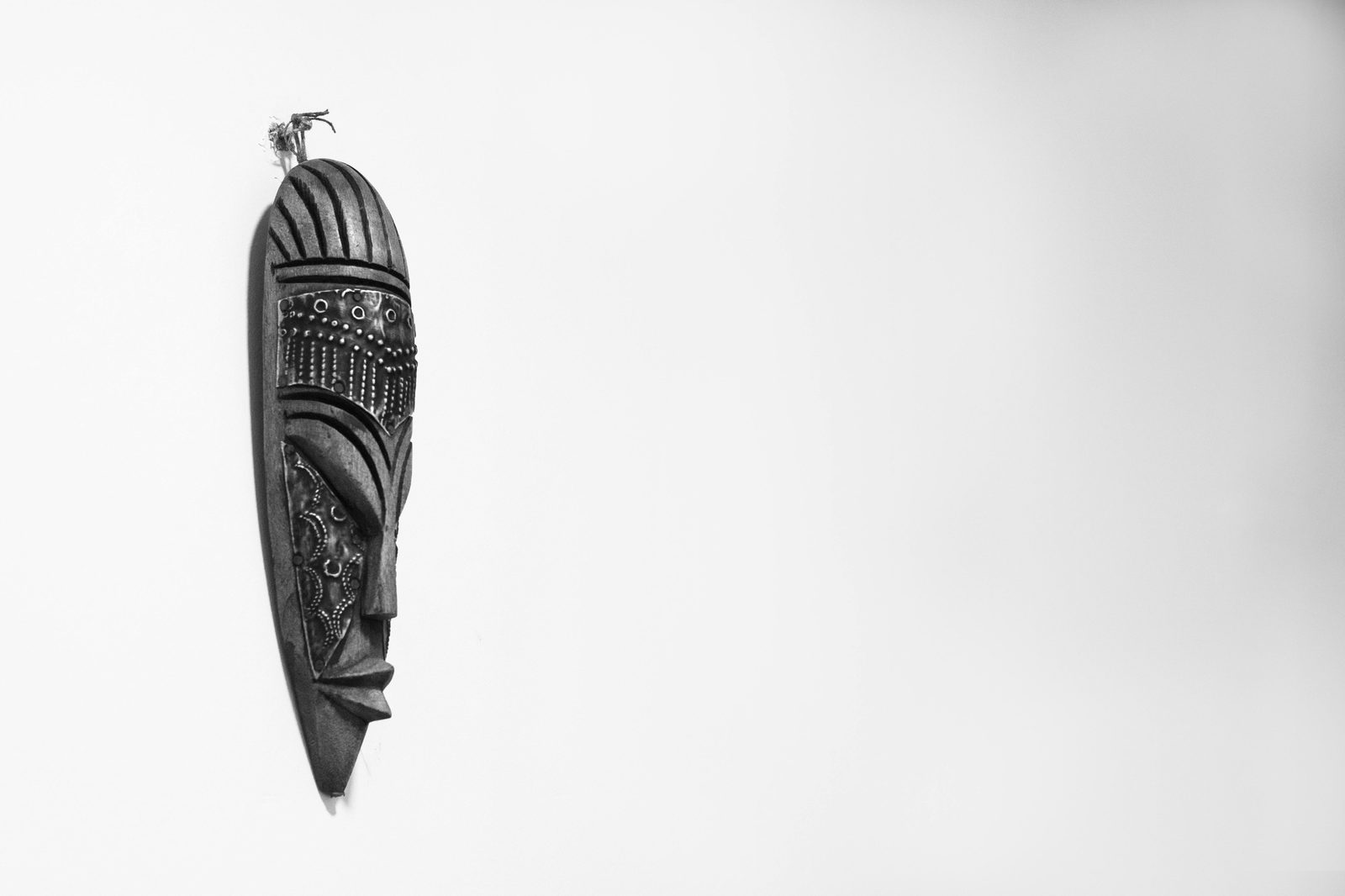 Detailed black and white photo of a wooden mask — the National Museum's ethnographic collection covers cultures from Greenland to Polynesia