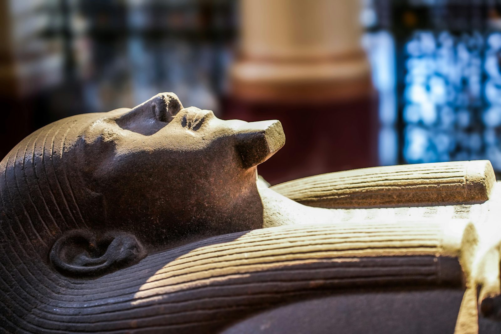 Close-up of an ancient Egyptian sarcophagus on display in a museum — the Glyptotek has Denmark's largest Egyptian collection outside the National Museum