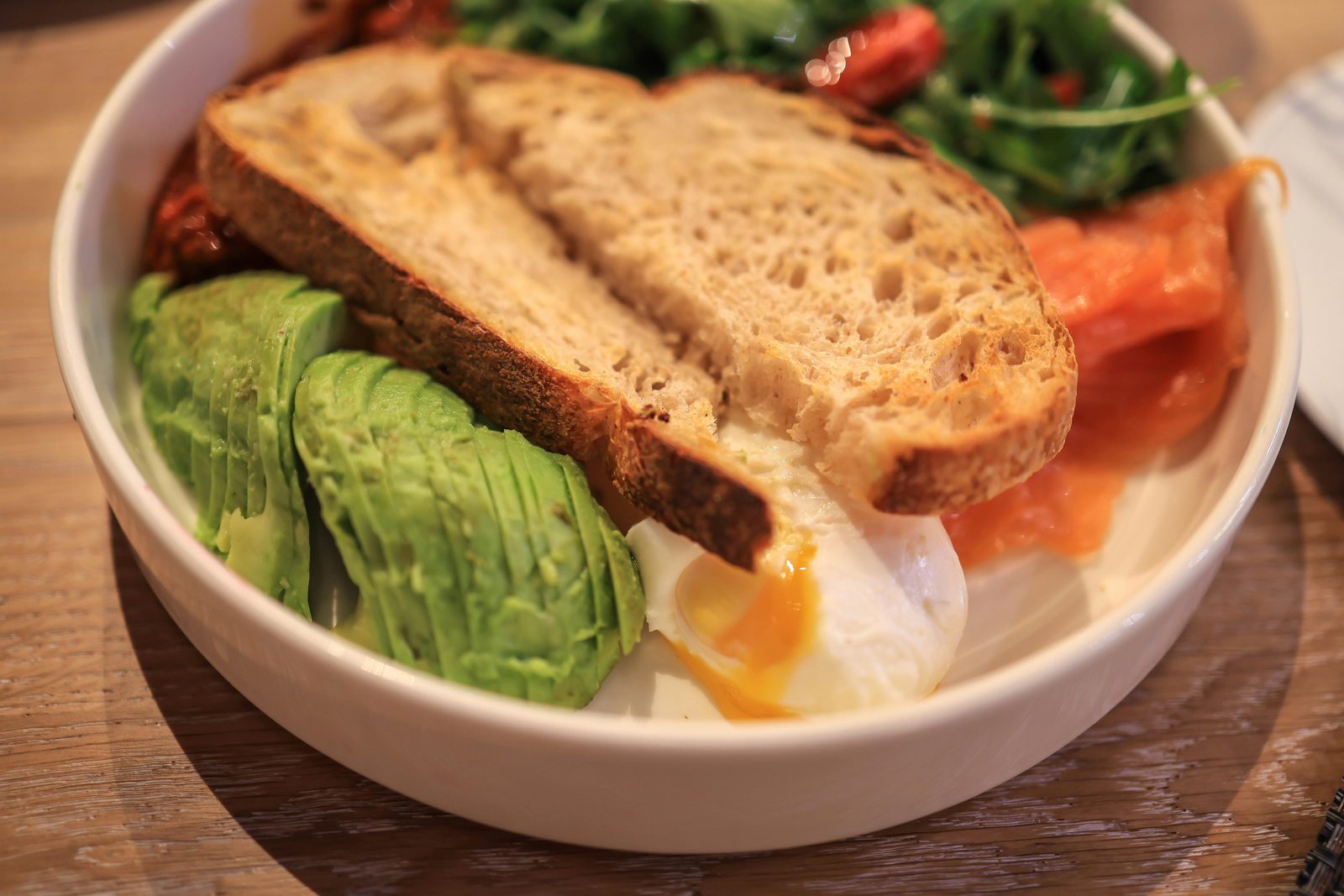 Avocado toast on sourdough — avocado on Hart Bageri sourdough is a Copenhagen brunch standard at most modern cafes