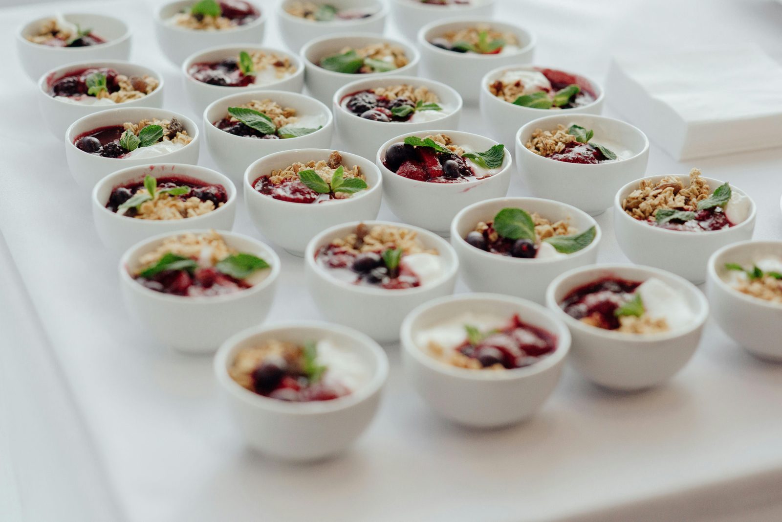 Brunch bowls with portion variety — Mad & Kaffe pioneered the 7-bowl brunch format that has become the Copenhagen brunch standard