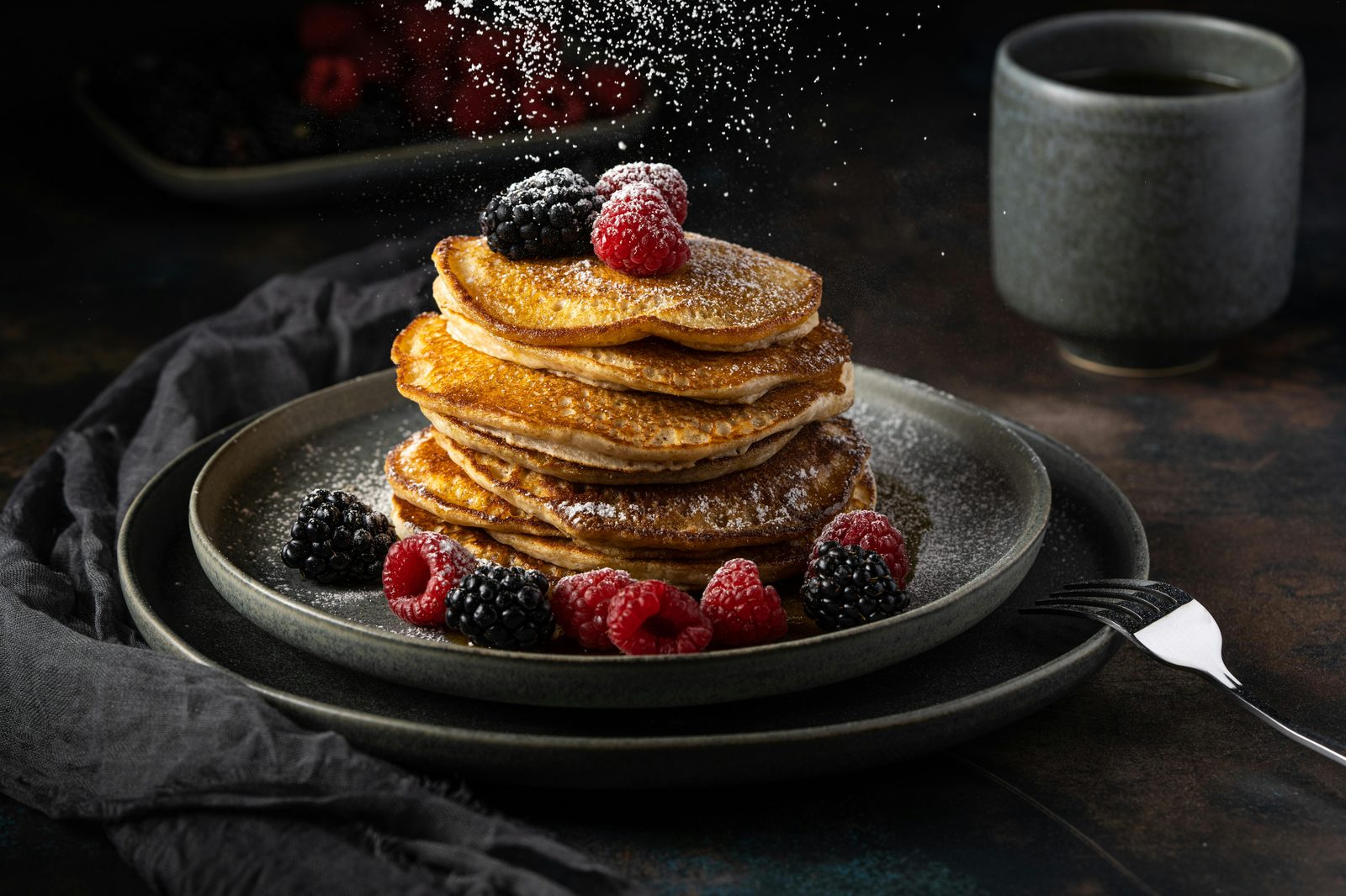Pancakes with berries and fluffy stack — Møller and other Copenhagen brunch spots serve fluffy American-style or thin Danish pancakes