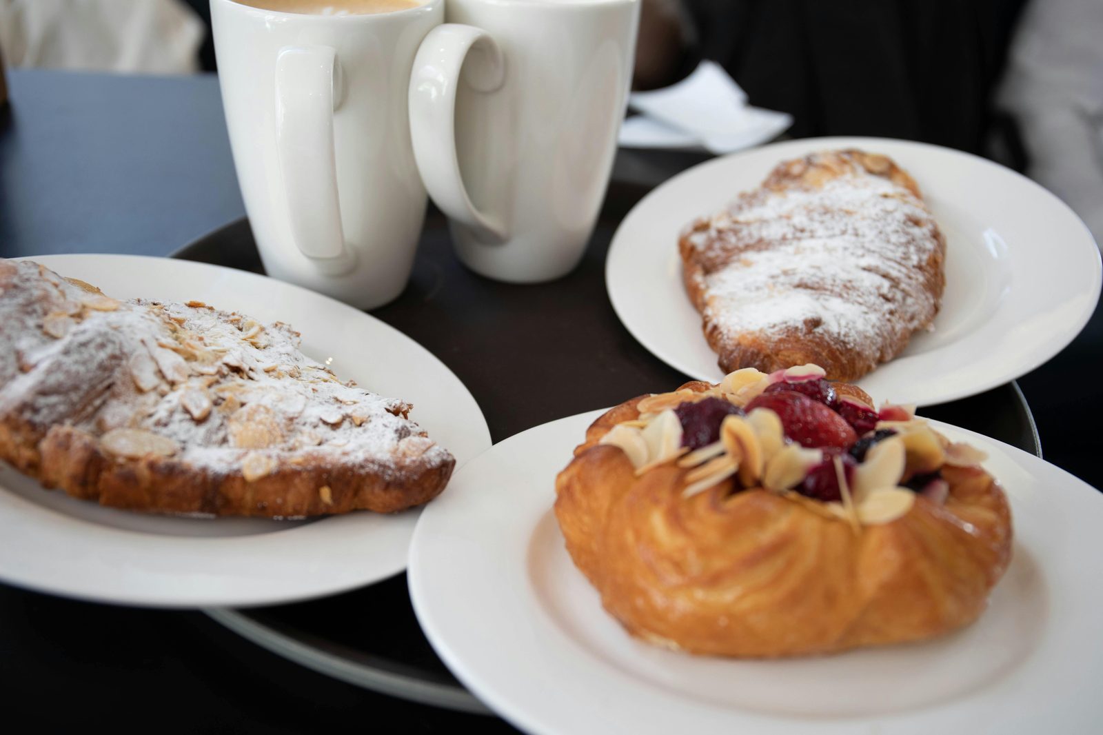 Coffee with pastry breakfast — Copenhagen specialty cafes typically pair coffee with Danish pastries from Hart Bageri or Juno