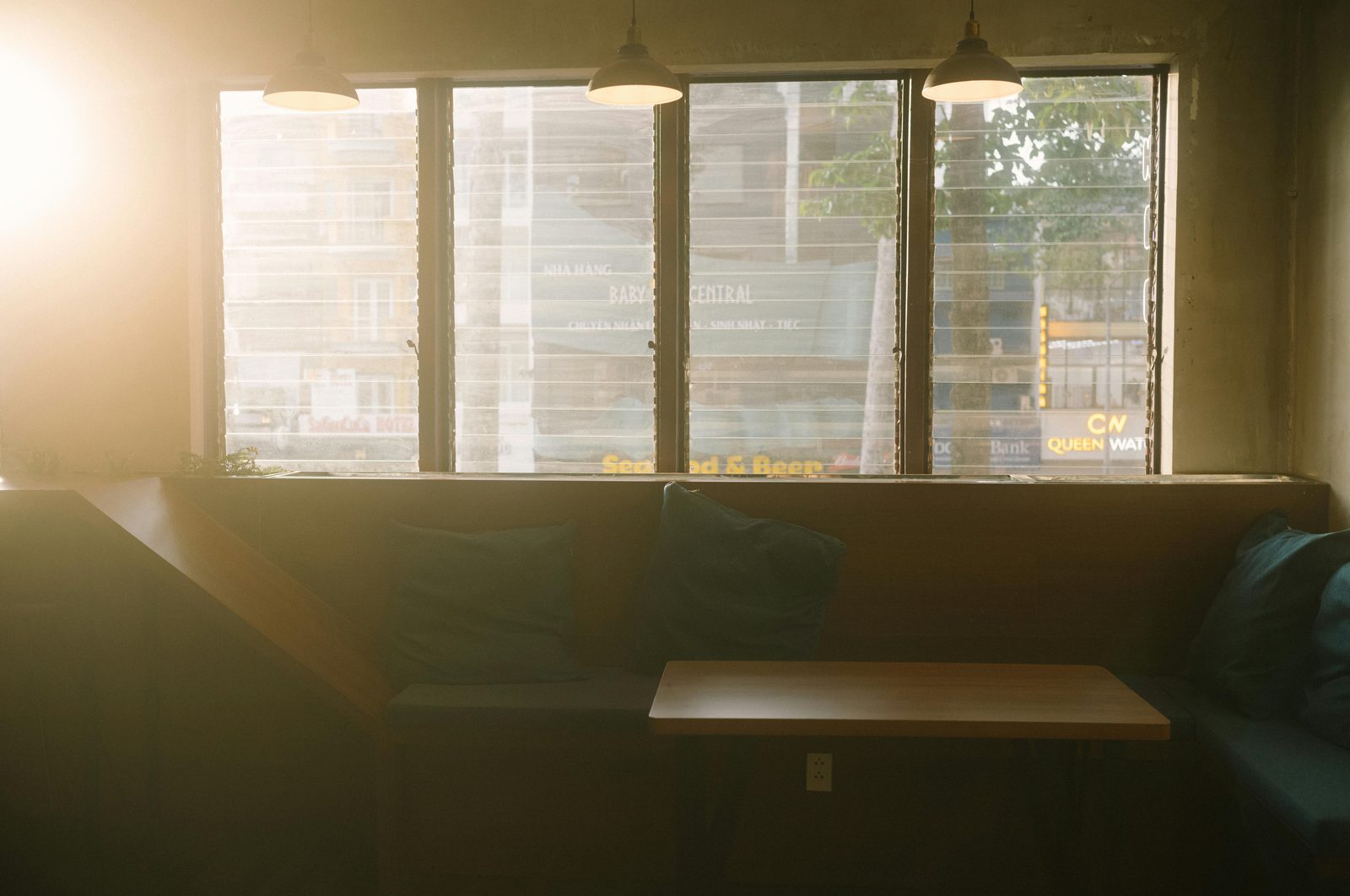 Cafe window with natural morning light — Copenhagen specialty cafes peak 08:00-11:00 with morning regulars and breakfast