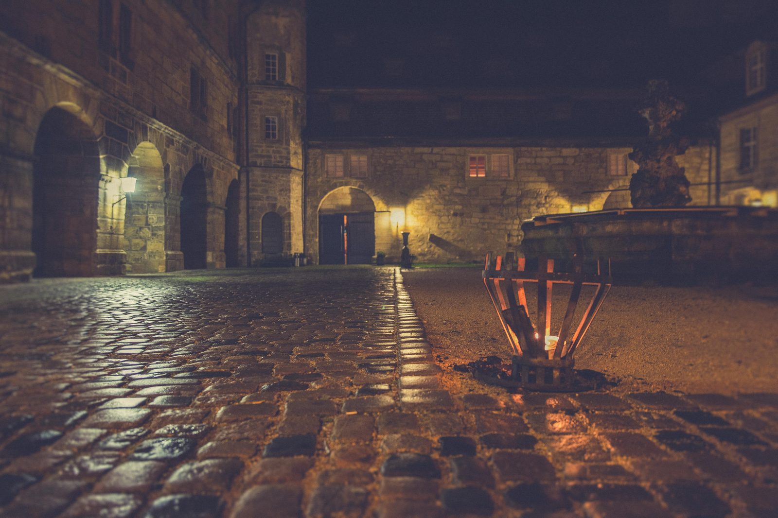Old brewery courtyard cobblestone — Carlsberg City preserves industrial-era brewery buildings, cobblestone courtyards, and brewery iron architecture