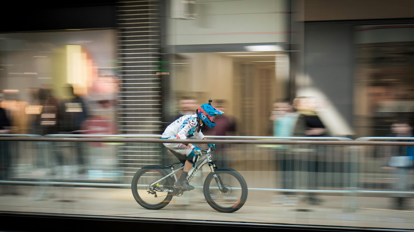Cyclist with bicycle helmet — Copenhagen helmet use is voluntary but recommended; rental shops include helmets at no extra charge