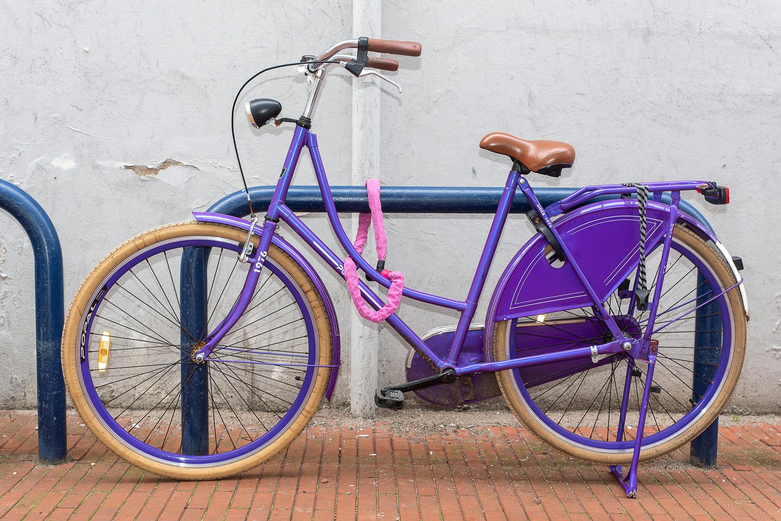 Bicycle locked at street rack — bike theft is the #1 Copenhagen crime; always use a U-lock and lock to a fixed object