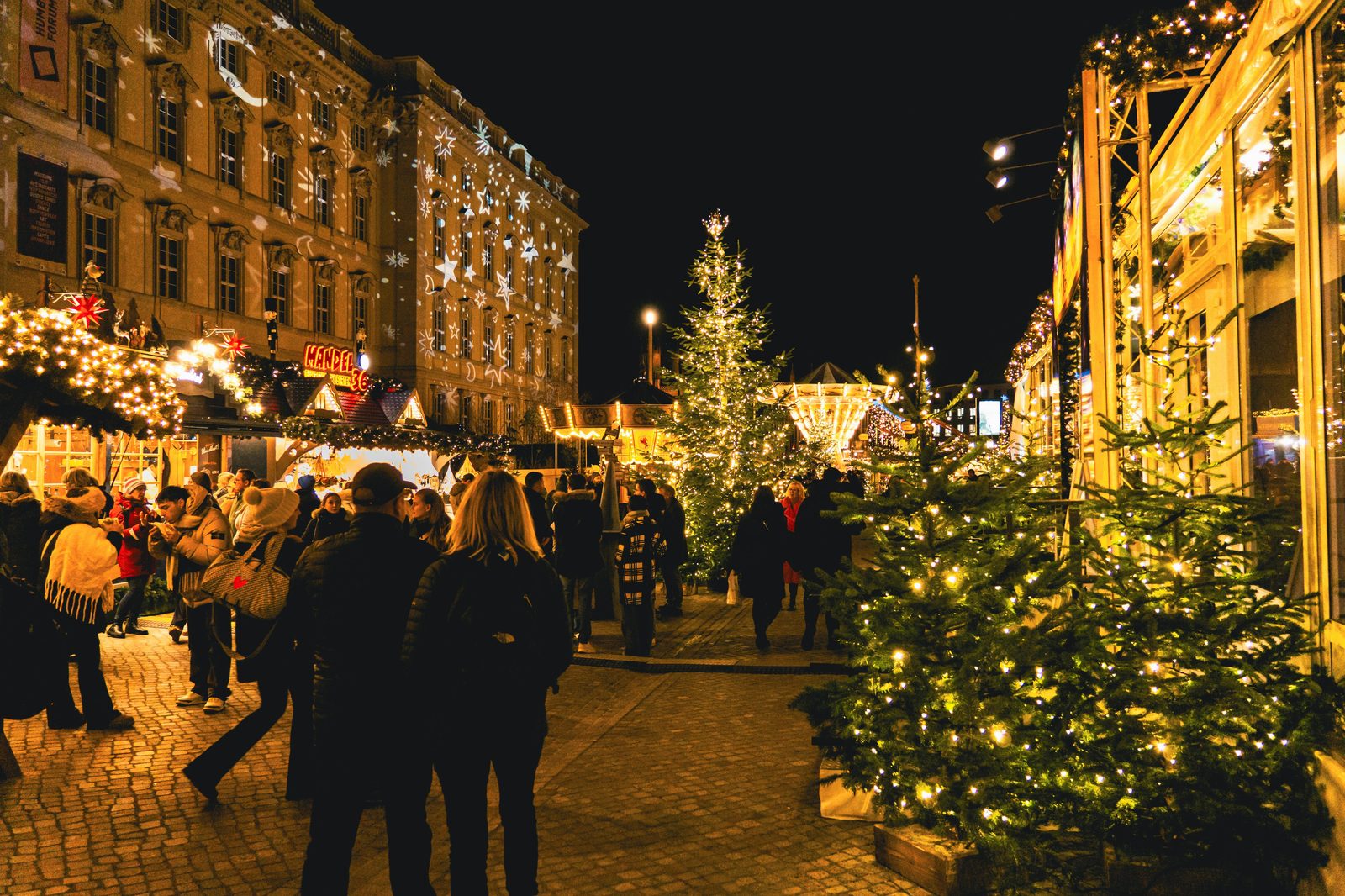 Christmas market lights stalls — Copenhagen Christmas markets run late November through December with traditional Danish gifts, glogg, and aebleskiver