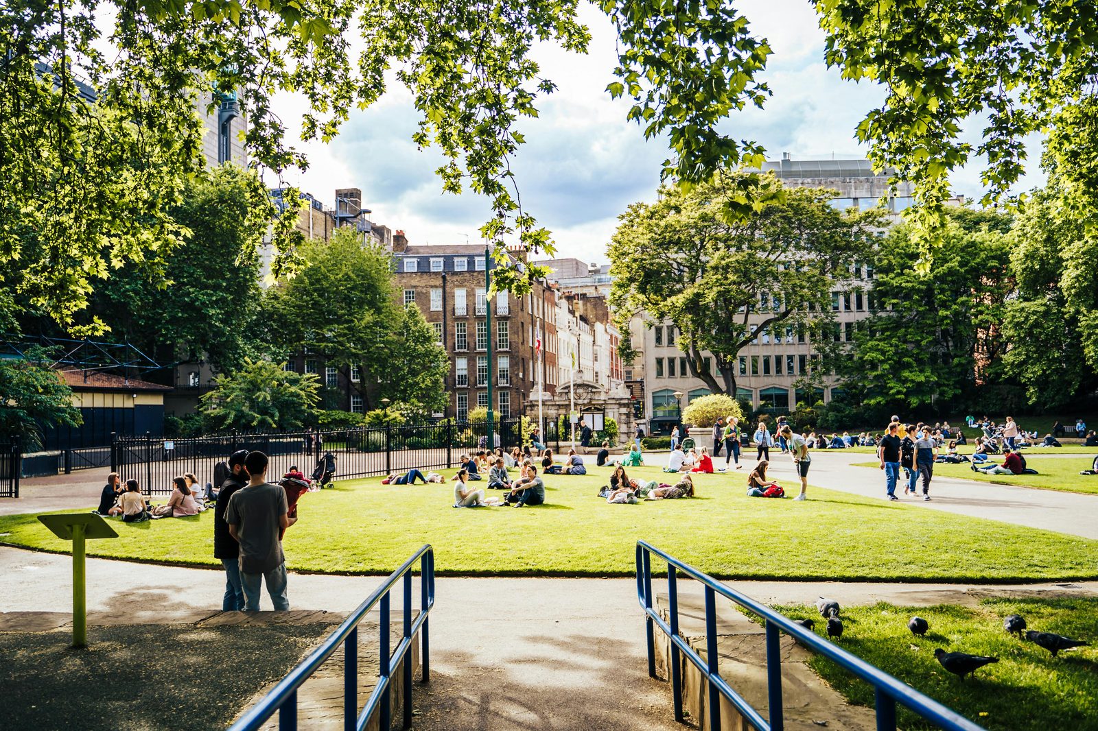 Summer city sunny day people — Copenhagen in July is the warmest month with 22°C peaks, 16-17 hours daylight, and peak tourist season