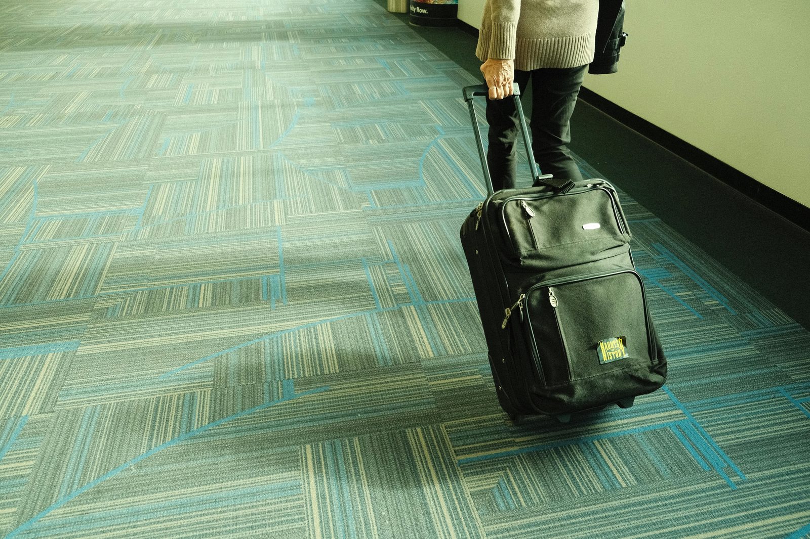 Airport traveler luggage transit — Copenhagen layover guide for 4-12 hour stops at CPH airport with city visit option