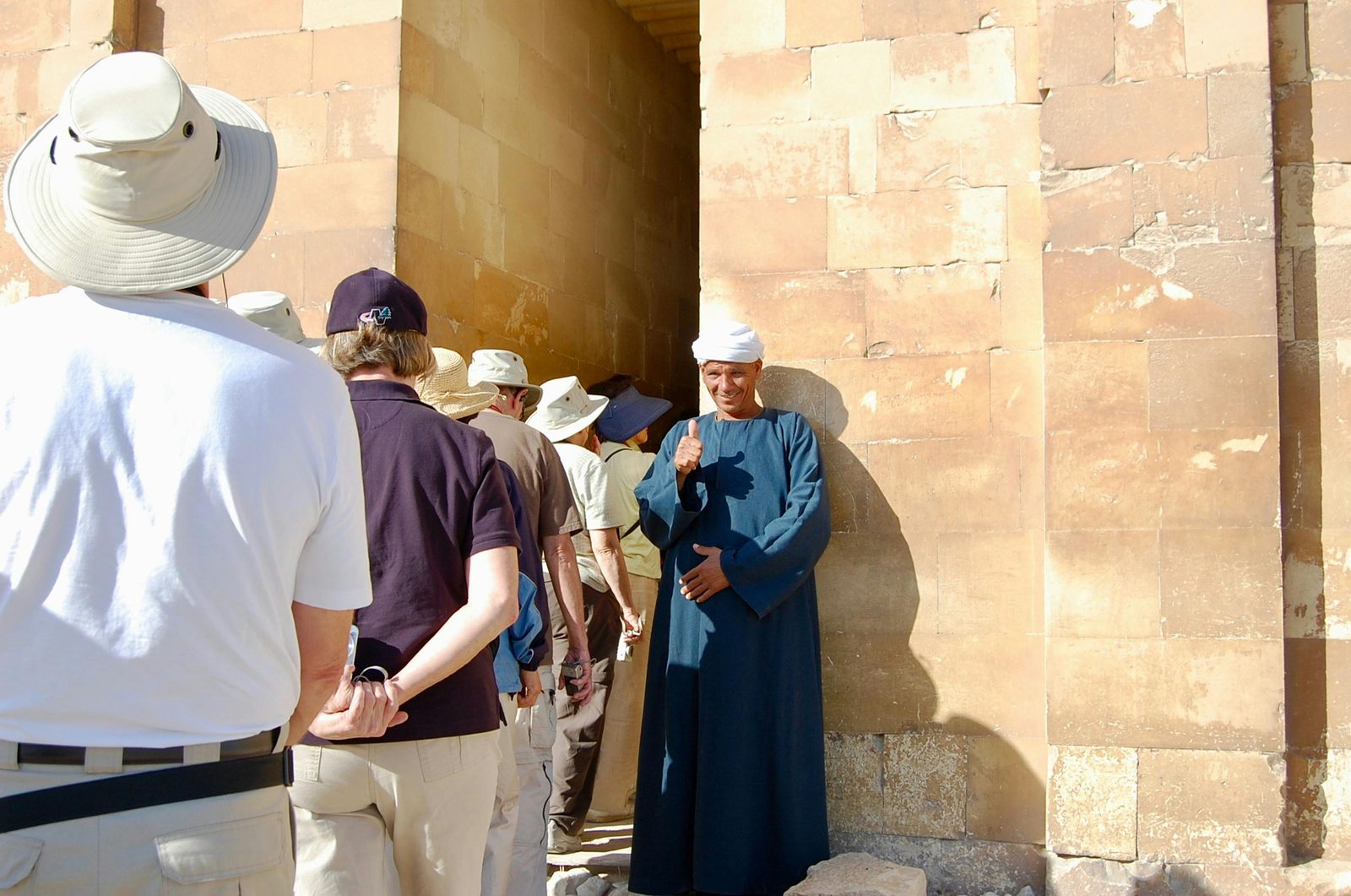 A tour guide leading a group of tourists in Copenhagen — guides are licensed and speak excellent English