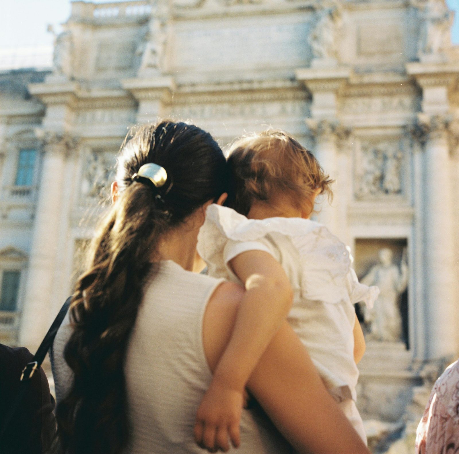 A young family walking with a toddler through central Copenhagen
