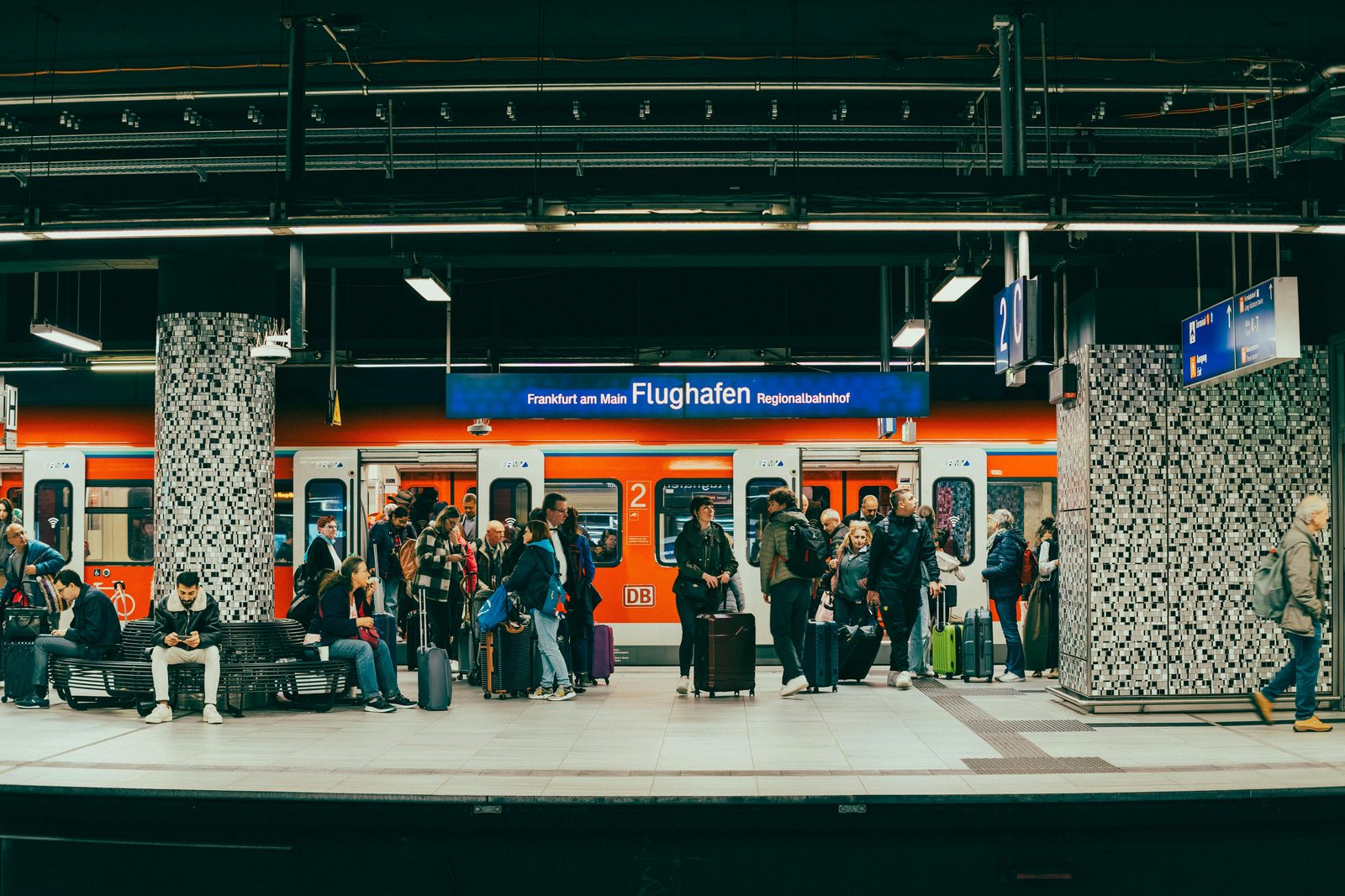 Airport train station with platform — Copenhagen Airport has both DSB train and Metro stations directly below the terminal