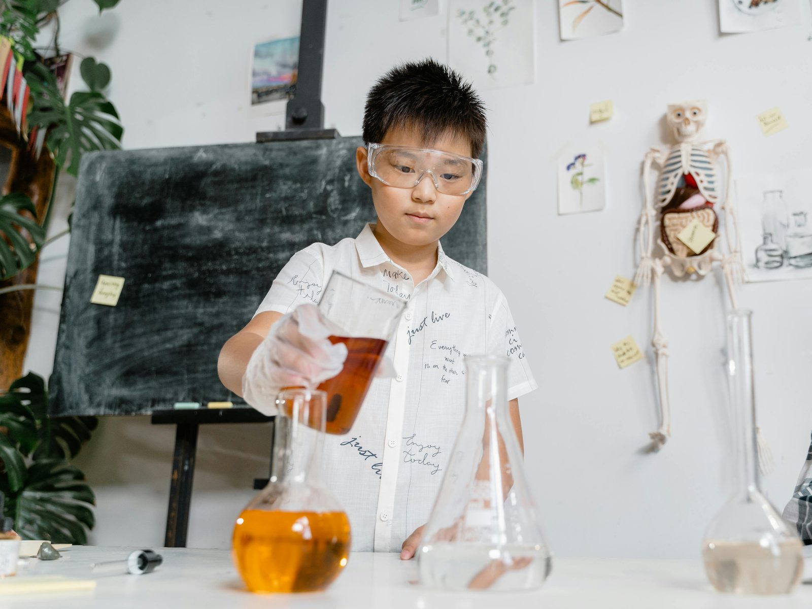 Children playing with pumps and water flow at the Experimentarium water zone