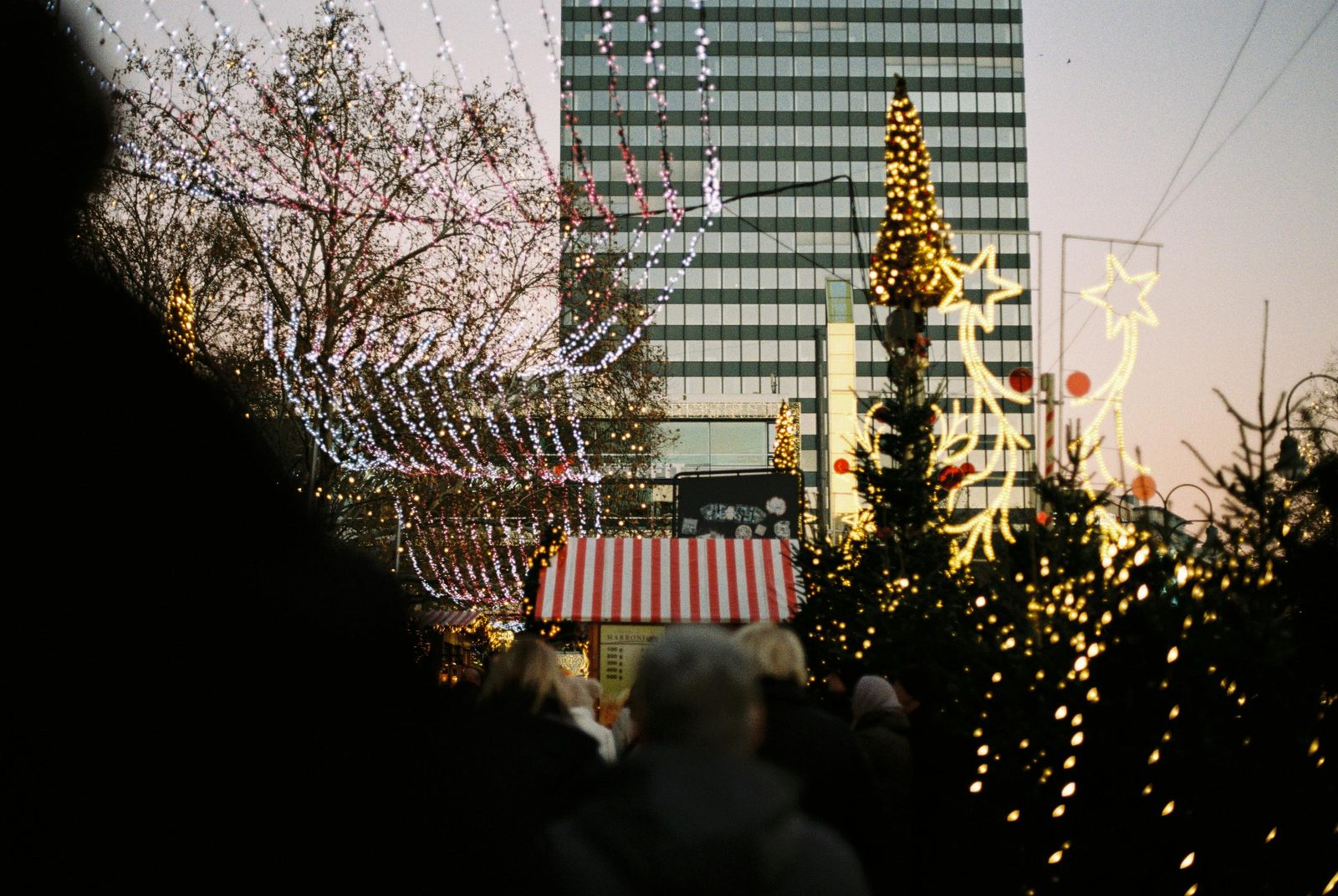 Evening crowds at the Hans Christian Andersen Christmas market on Town Hall Square Copenhagen