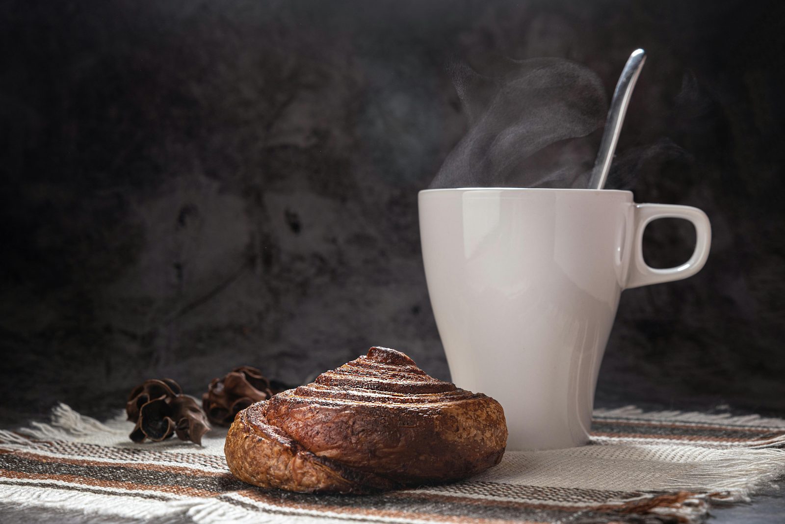 Cinnamon bun coffee winter — Copenhagen hygge cafe culture features cinnamon rolls (kanelsnegle) with coffee as the perfect winter treat