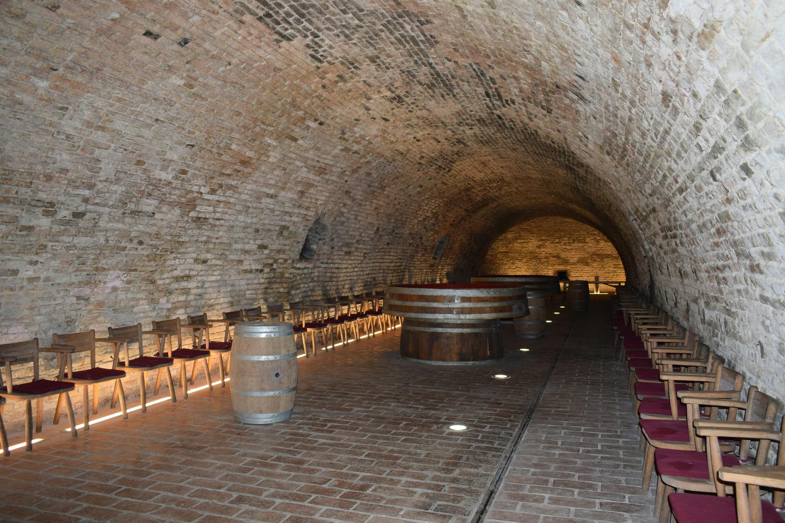 Historic stone cellar with wine and elegant decor — Kong Hans Kælder is Copenhagen's only Michelin-starred restaurant in a 12th-century stone cellar