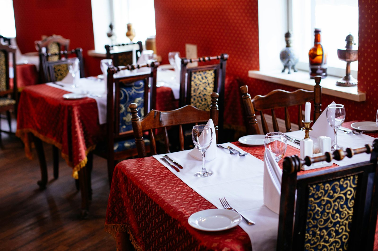 Elegant fine dining restaurant interior — Copenhagen Michelin dining rooms range from Geranium's 8th-floor stadium view to Alchemist's planetarium
