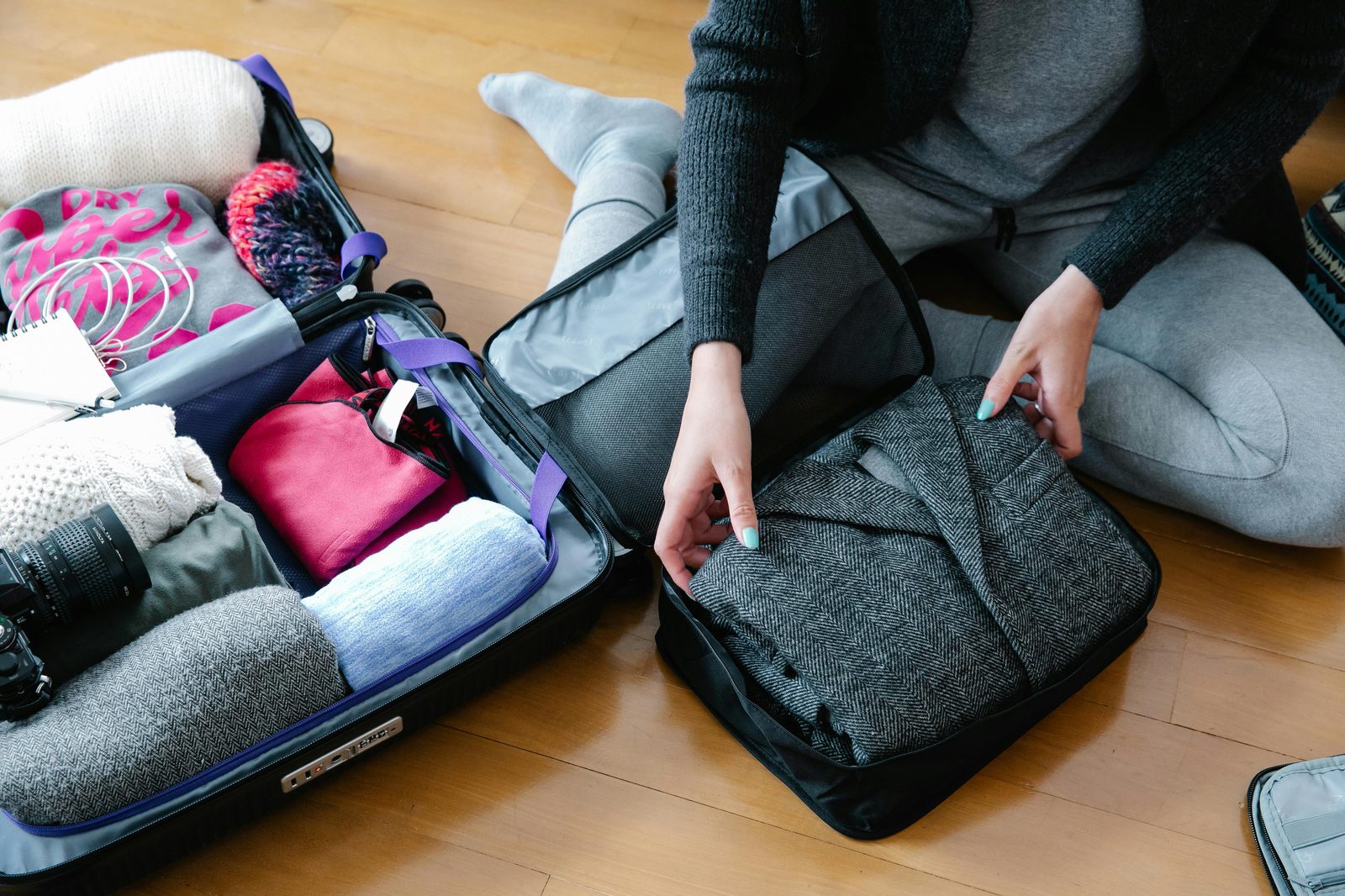 Packing cubes organized luggage — Packing cubes help organize Copenhagen layered approach efficiently