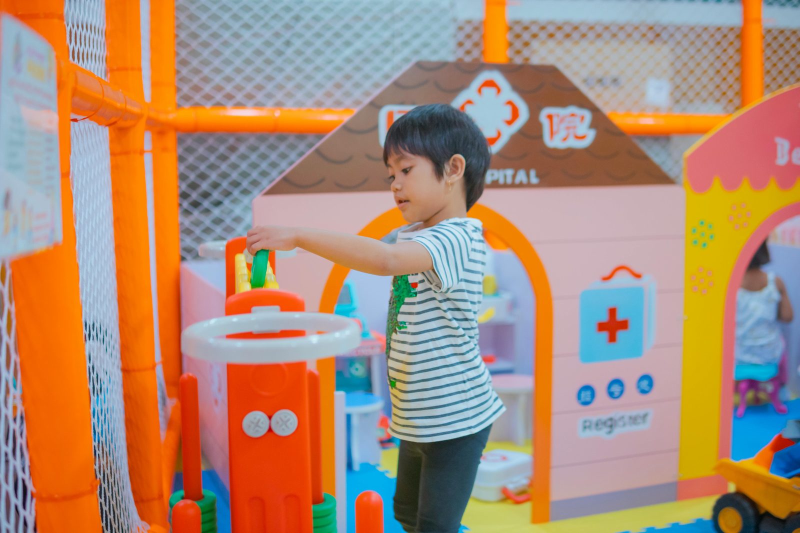 Children at an indoor playground in Copenhagen on a rainy day