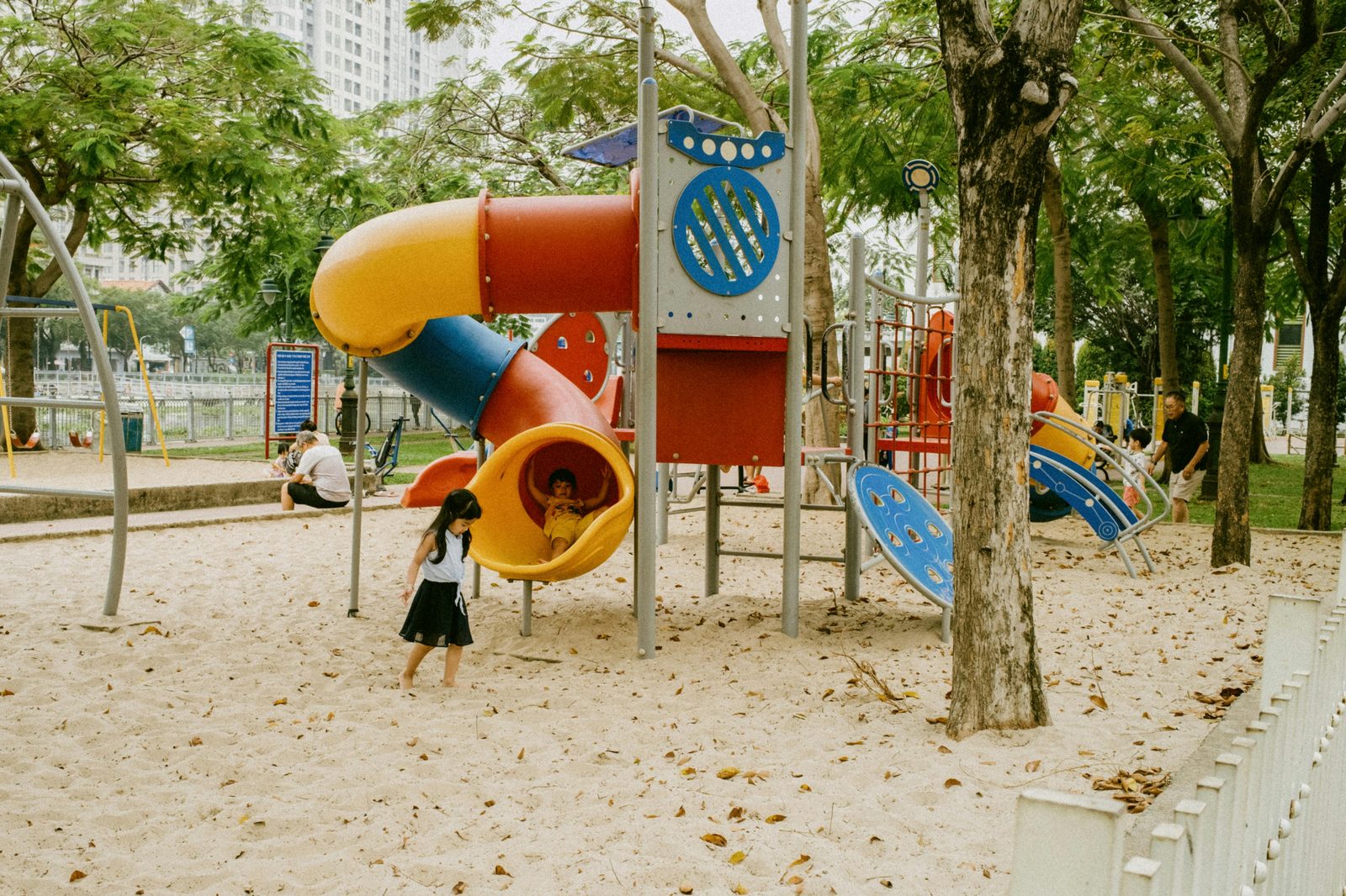 Playground set among trees in a Copenhagen park
