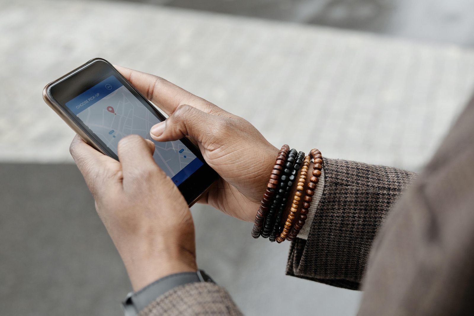 A visitor with a phone and map — self-guided Copenhagen walking tours via audio apps are a low-cost alternative