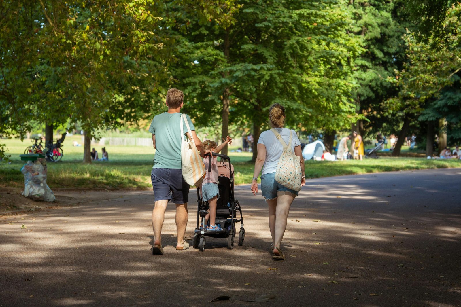 A stroller-friendly paved path through a Copenhagen park