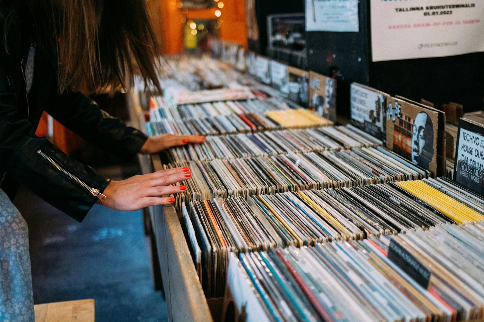 A teenager browsing vinyl records in a Norrebro vintage shop