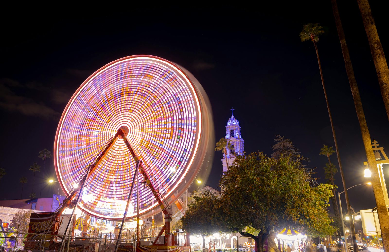 Tivoli's illuminated Ferris wheel at night during the Copenhagen Christmas Market