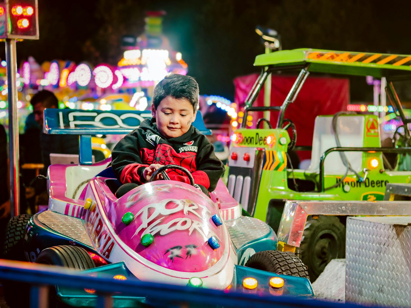 Small children on gentle rides in Rasmus Klump's World, Tivoli's under-7 zone
