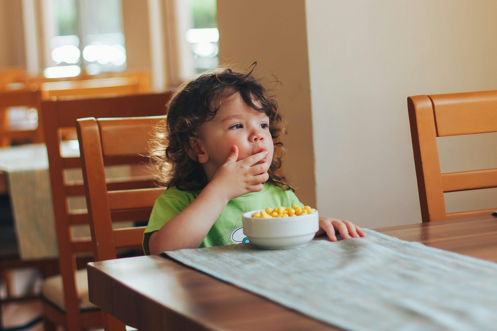A toddler having a snack in a family-friendly Copenhagen cafe