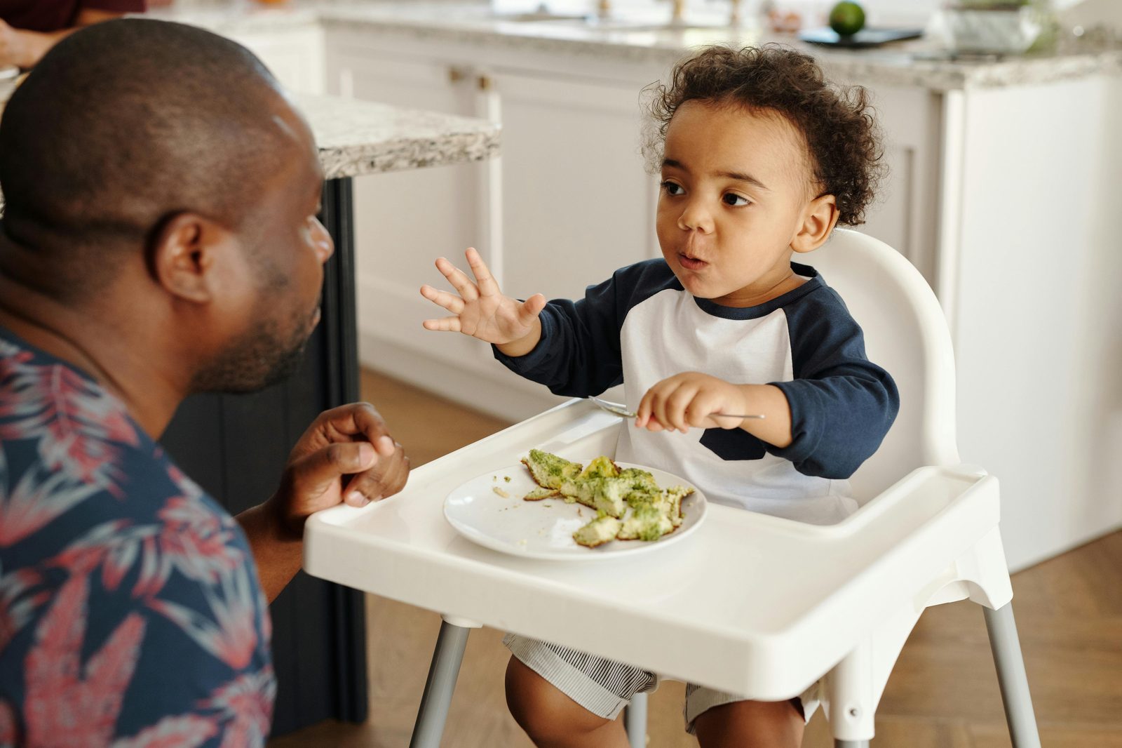 A toddler in a high chair at a family-friendly Copenhagen restaurant