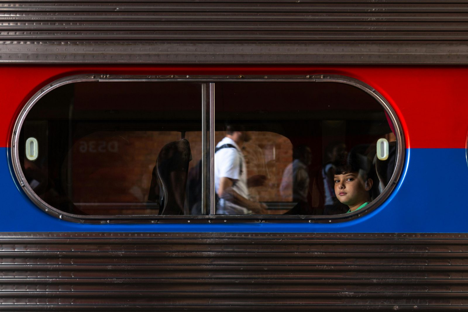 A toddler watching a driverless Copenhagen metro train