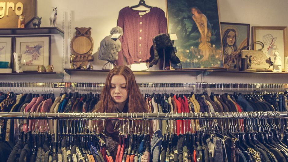 Racks of vintage clothing in a curated Copenhagen second-hand boutique
