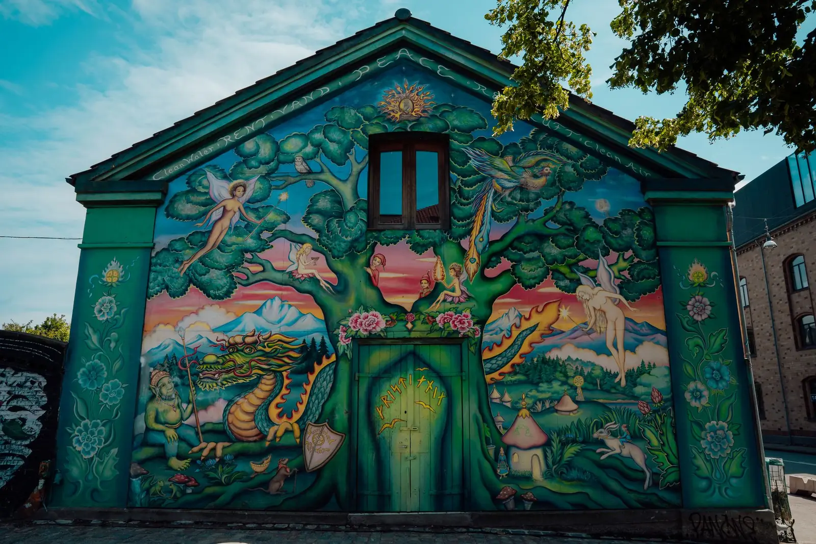A painted gable mural on a house in Freetown Christiania, Copenhagen