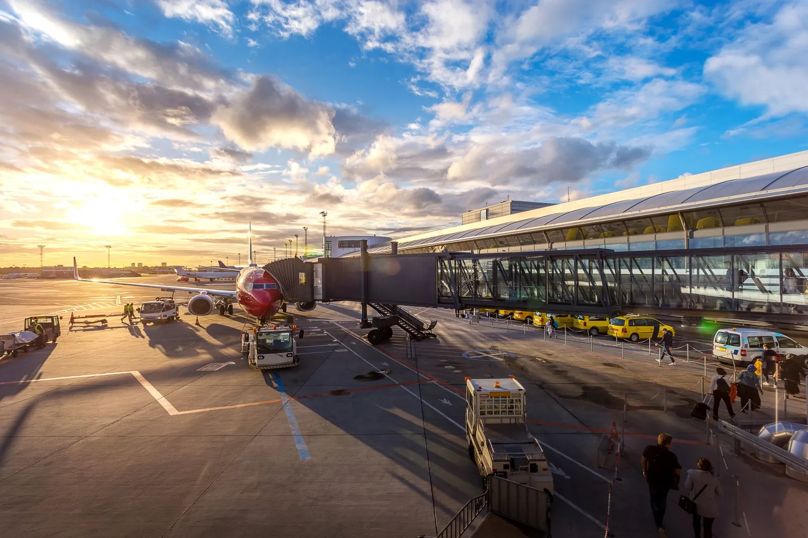 Aircraft at the terminal at Copenhagen Airport at sunset