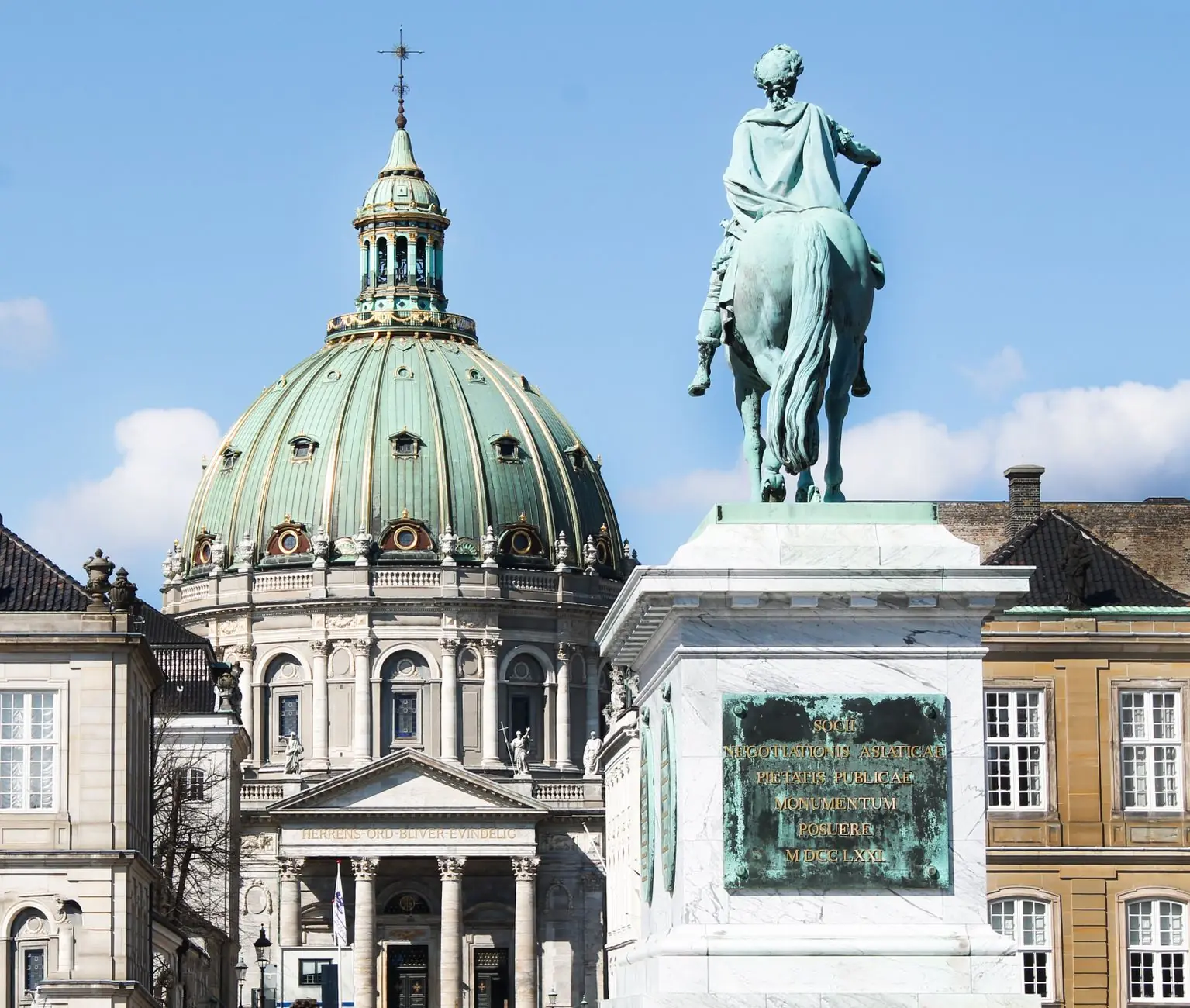 The equestrian statue of Frederik V on Amalienborg Square with the Marble Church dome behind