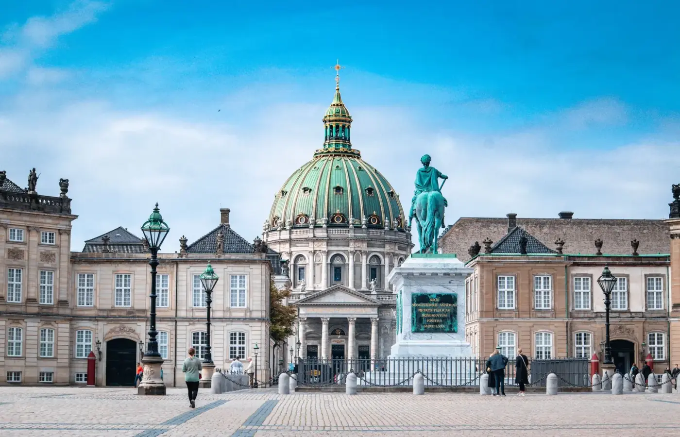 The green dome of the Marble Church behind the equestrian statue of Frederik V in Amalienborg square