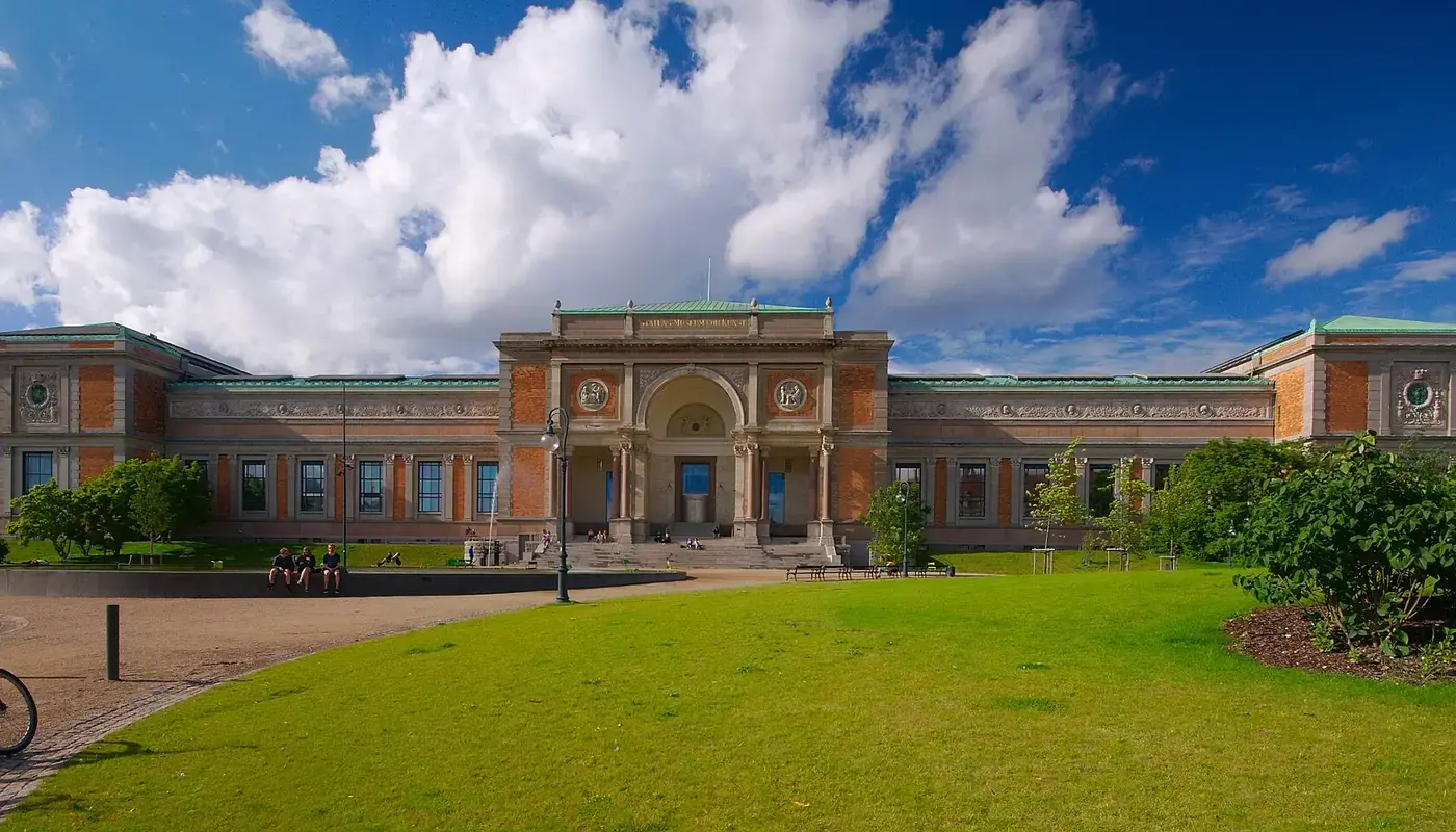 The 1896 main building of SMK, the National Gallery of Denmark, seen across the lawn on a sunny day